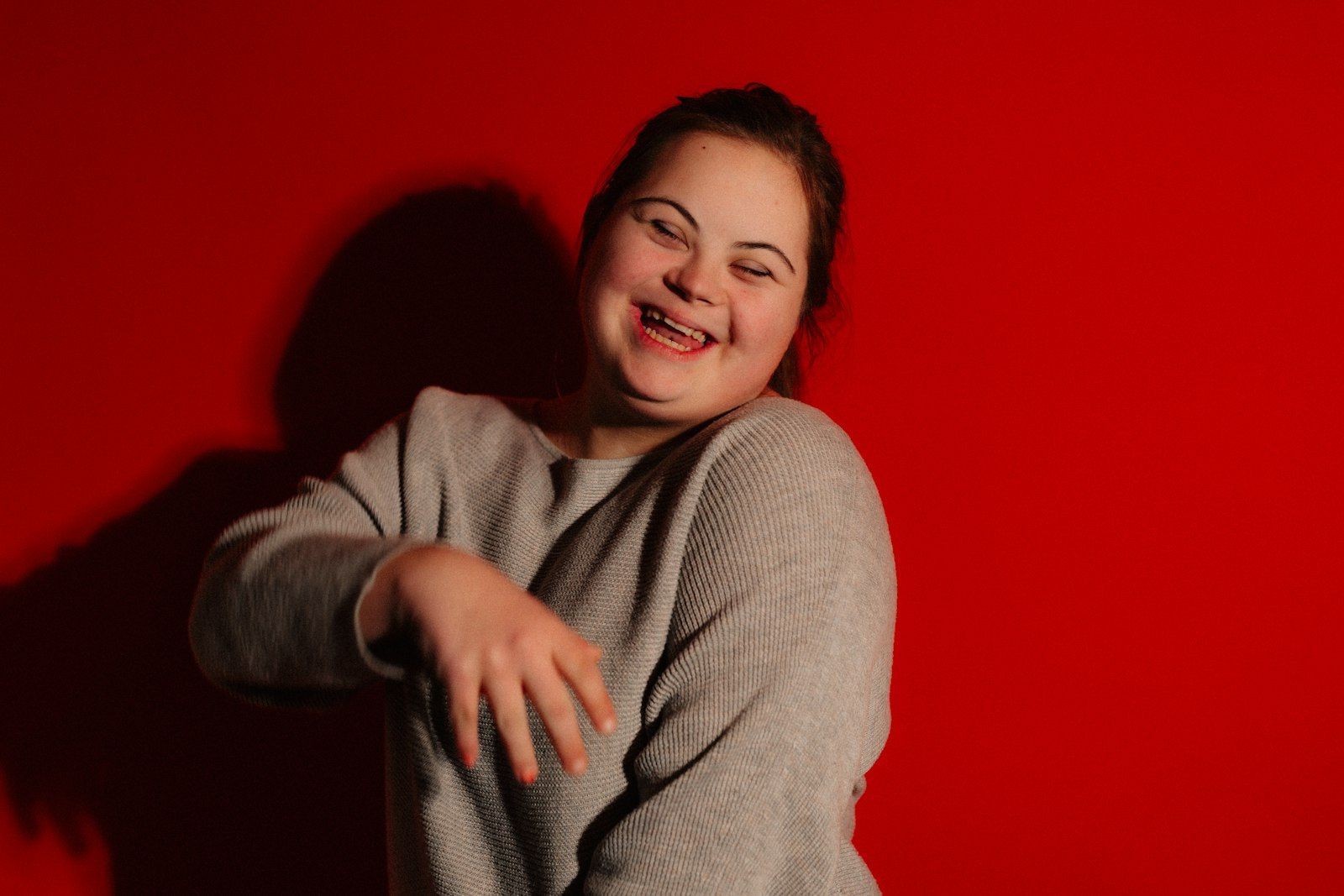 Young woman with Down syndrome laughing